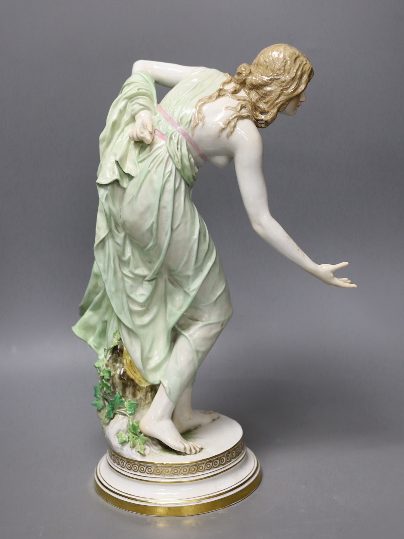 A Meissen Art Nouveau figurine of a young lady playing boules, early 20th century, modelled by Walter Schott, 37cm high